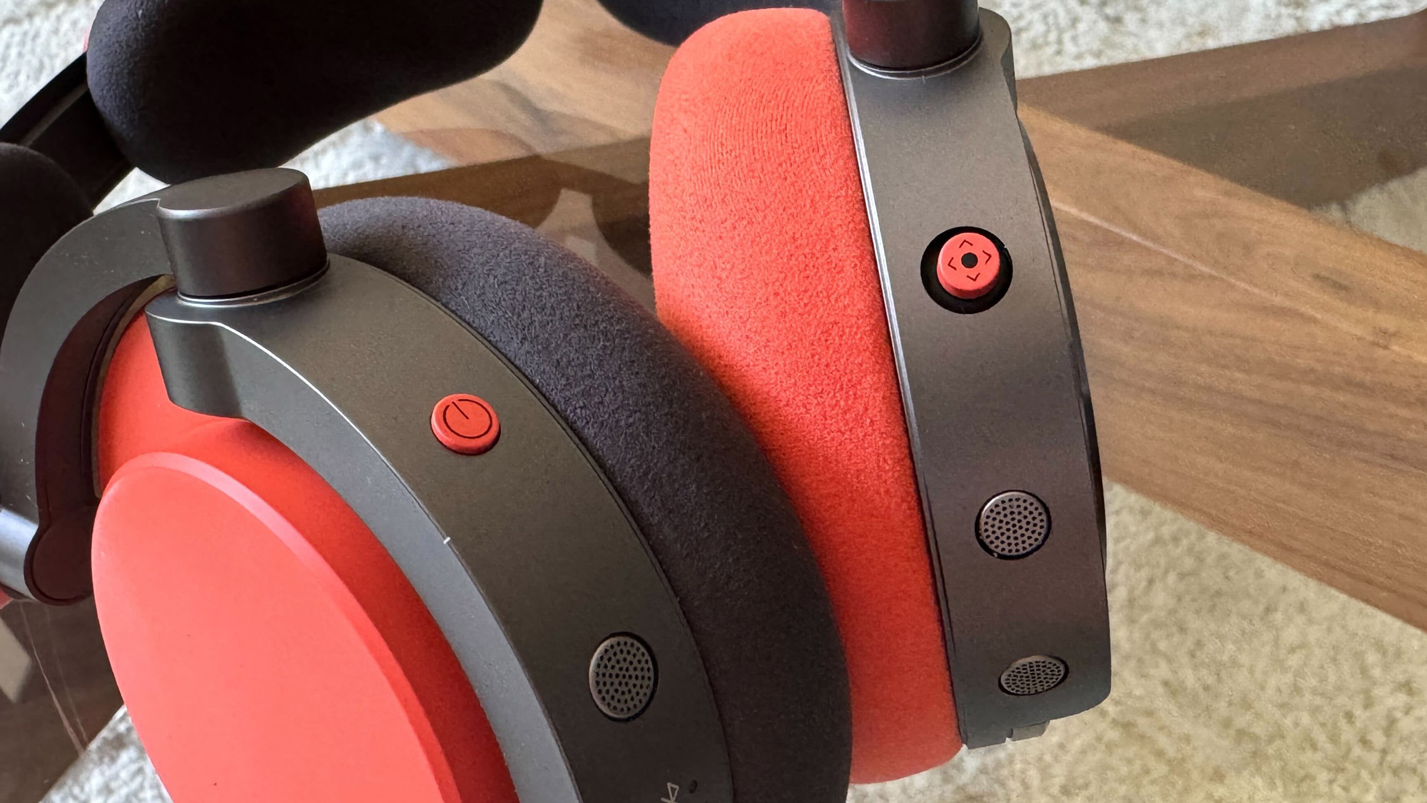 Close up image of the physical buttons on the Dyson OnTrac headphones