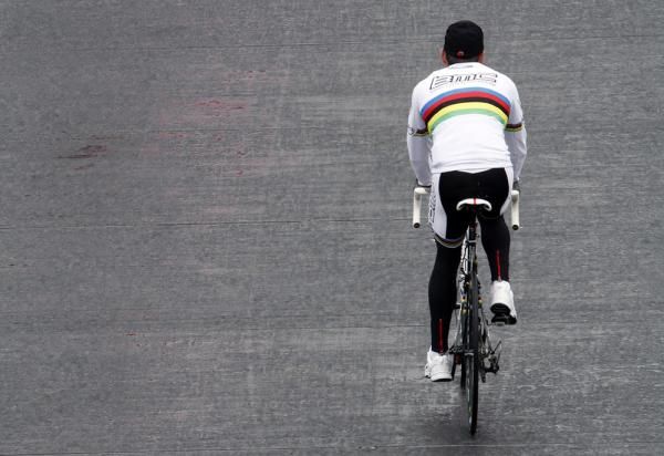 The World Champion, Cadel Evans (BMC Racing Team), makes his way solo to the sign-on