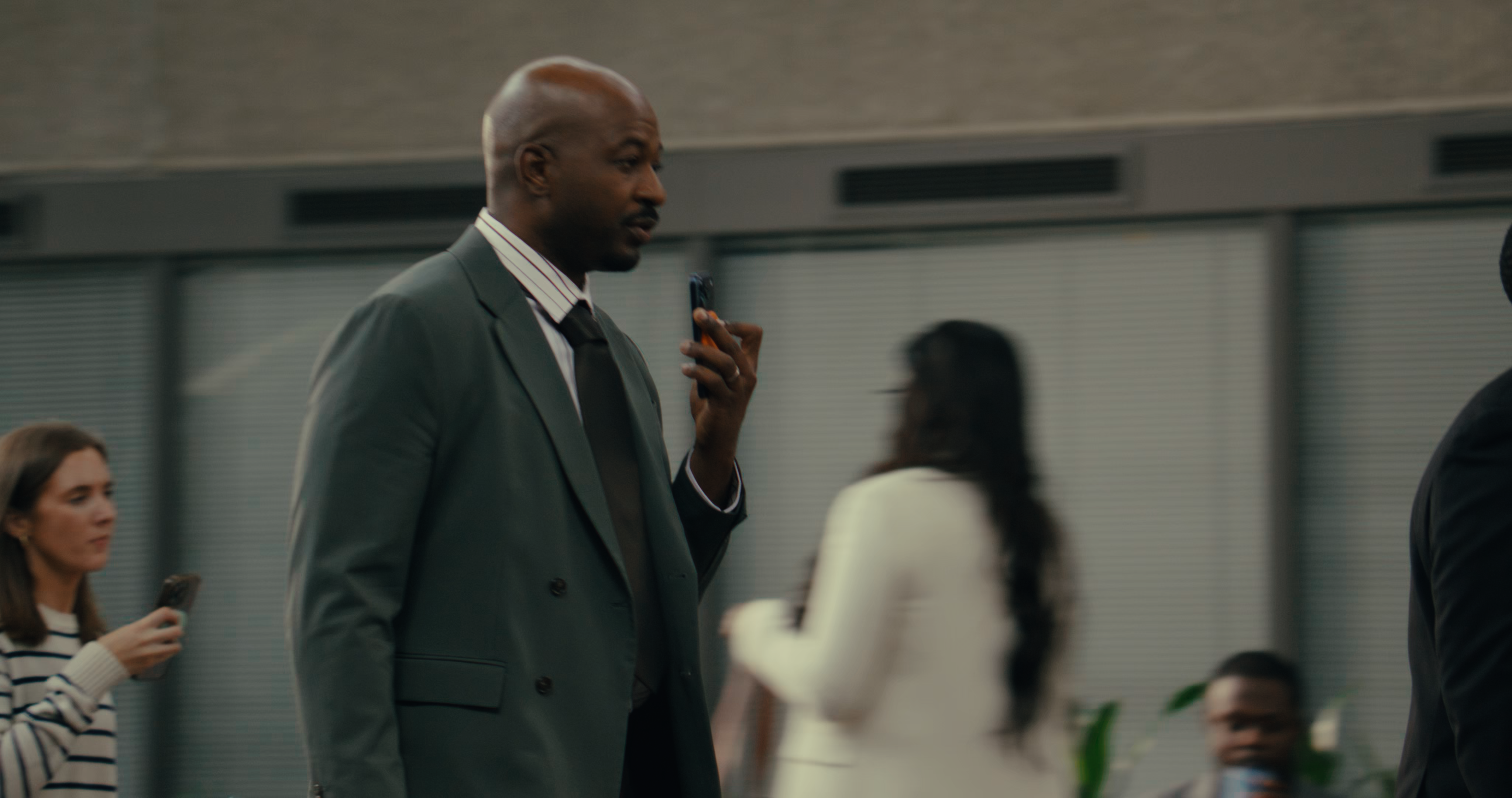 SpeakON MagSafe AI button in use by business professions using iPhones.