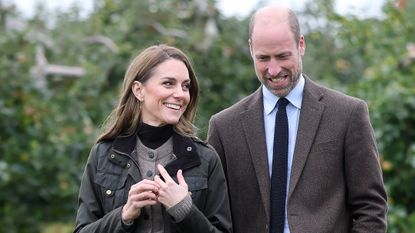 Catherine, Princess of Wales and Prince William, Prince of Wales smile during a visit to Long Meadow Cider on October 14, 2025 in Craigavon