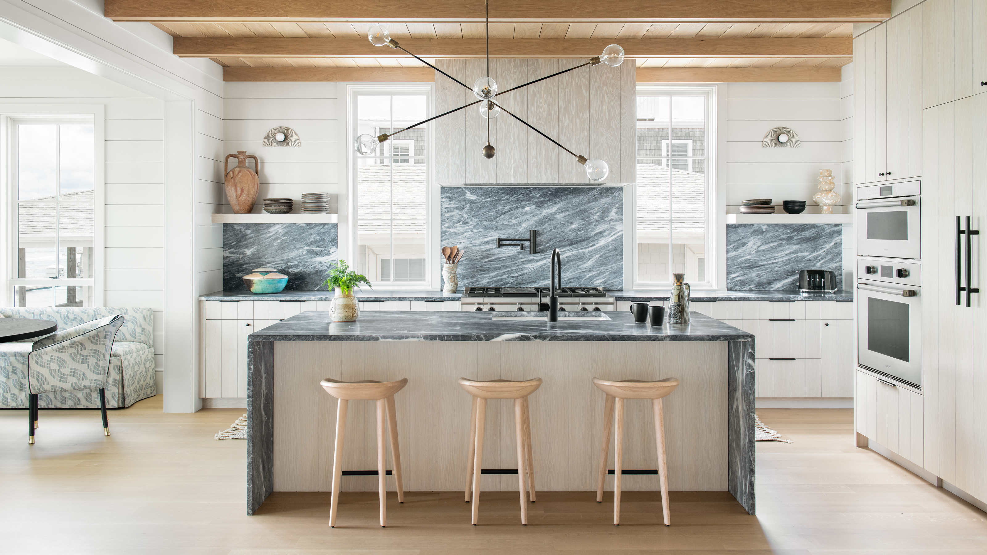 all white kitchen light green backsplash