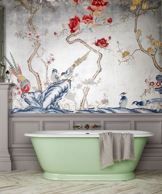 Best bathroom designers Drummonds showcasing an oriental print wallpaper and pale green bath.