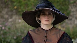 Shirley Henderson in a dark hat and coat as Aunt Western in Tom Jones.