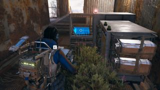 Arc Raiders: A raider wearing a blue jumpsuit and techy backpack carrying a heavy box towards a Field Depot drop-off point.