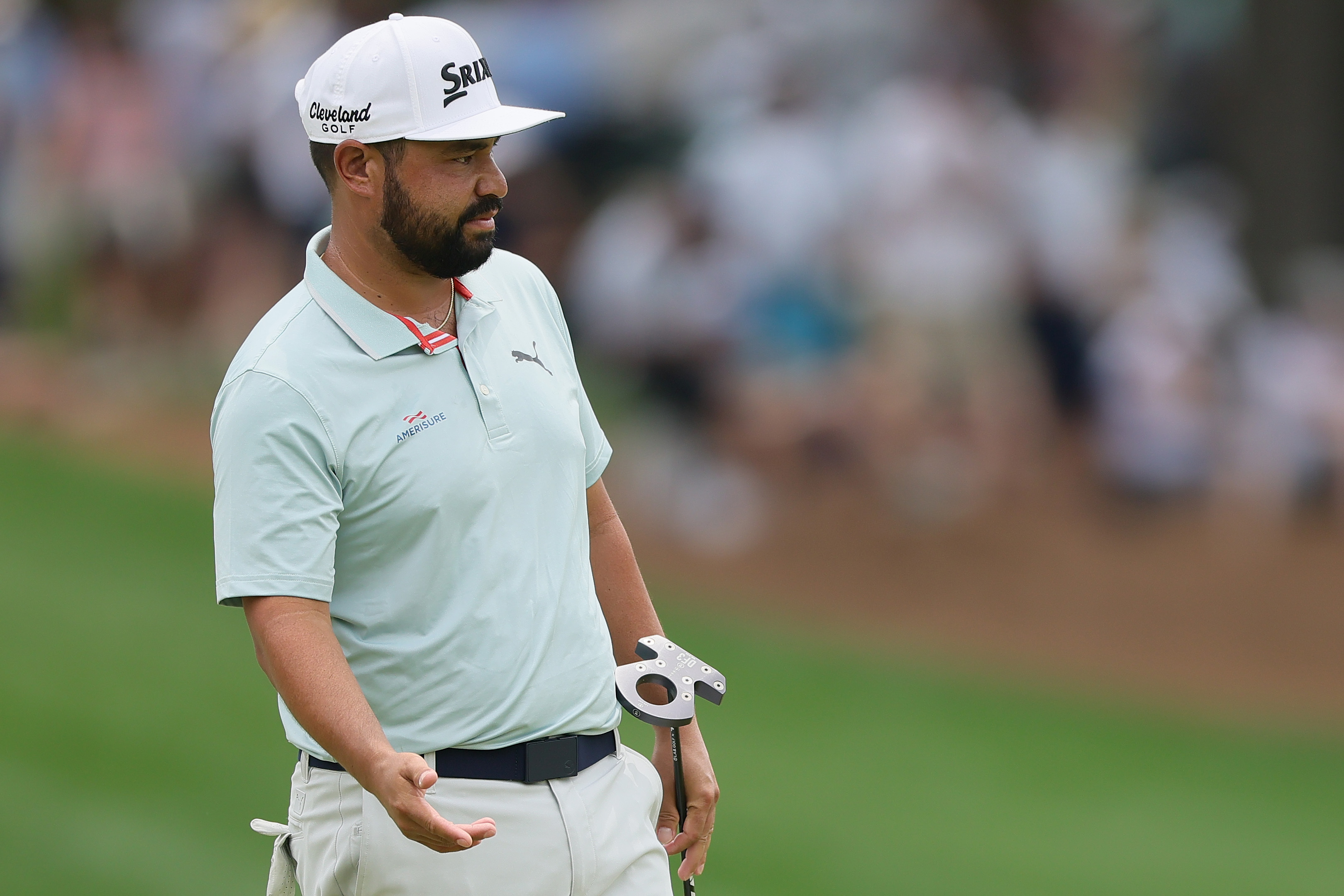 J.J. Spaun watches his putt