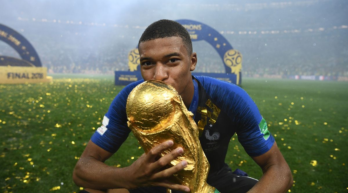 France&#039;s forward Kylian Mbappe kisses the World Cup trophy after the Russia 2018 World Cup final football match between France and Croatia at the Luzhniki Stadium in Moscow on July 15, 2018.