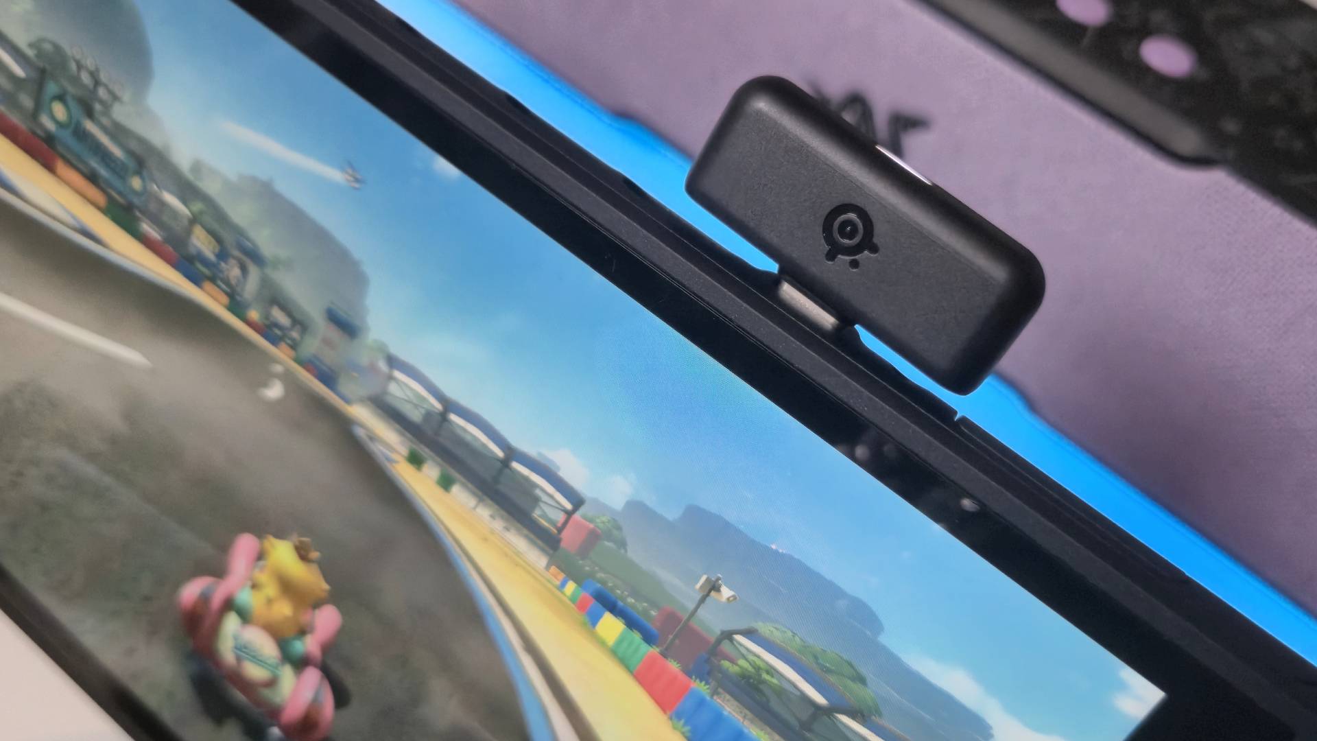 Photo by Rosalie Newcombe of the 2.4GHz dongle of the SteelSeries Arctis Nova gaming headset sitting in the Nintendo Switch 2.