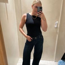 An image ofBest Knockoff Luxury Clothing
's shopping editor in the best indigo jeans. 