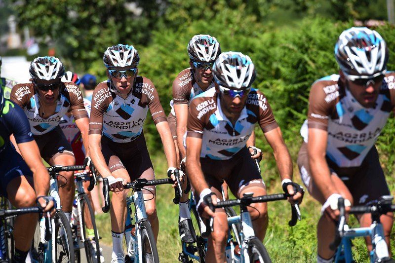 Romain sitting second from left with his Ag2r teammates