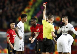 Paul Pogba, centre, was sent off in the first leg of the Champions League last 16 clash at Old Trafford (Martin Rickett/PA)