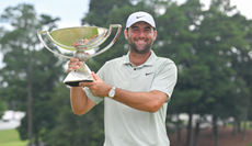 Scottie Scheffler holds the FedEx Cup trophy