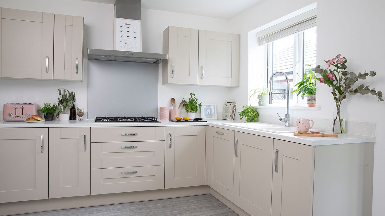 cream shaker kitchen with chrome handles pink pots ceramic sink chrome tap herbs