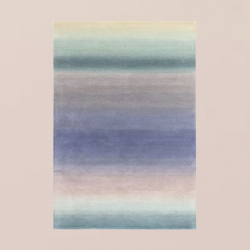 A mauve, pink, and blue ombre rug