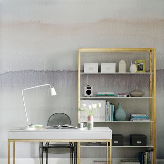 Home office with pastel mural wall and metallic furniture