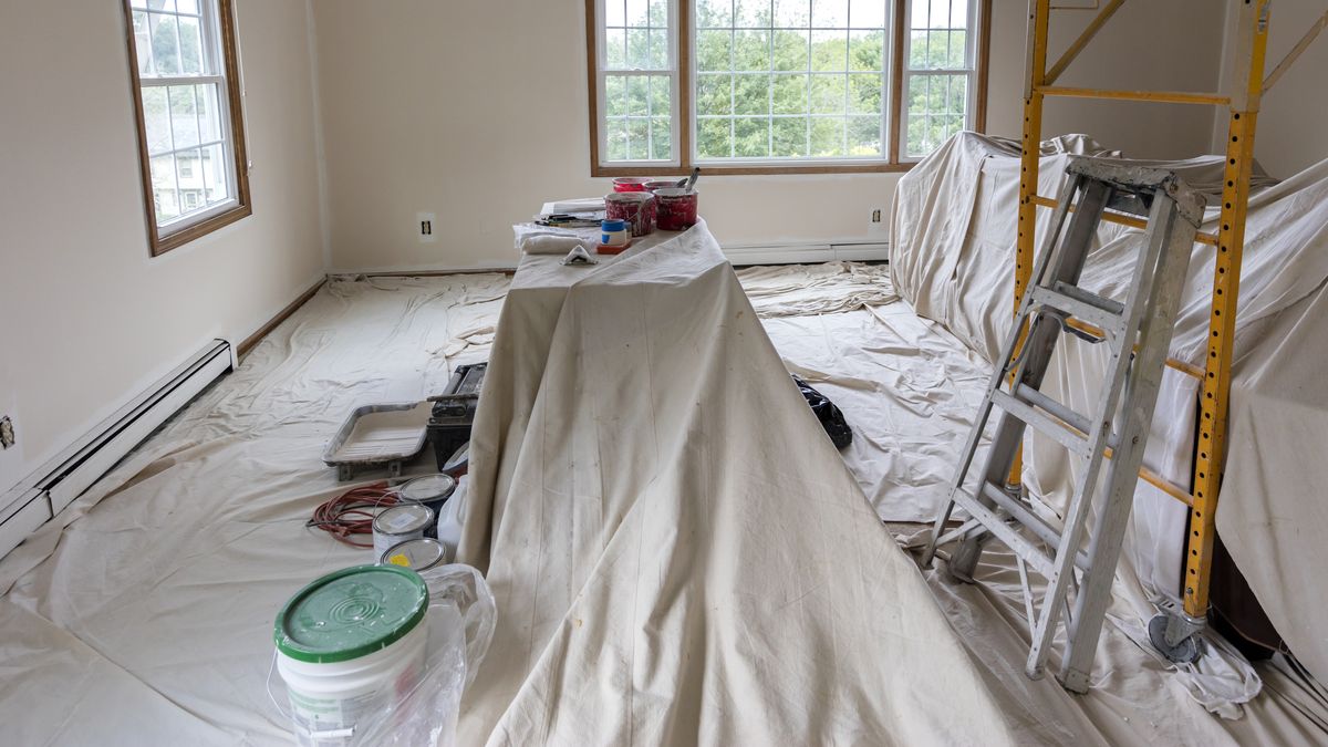 Room covered in drop cloths for painting