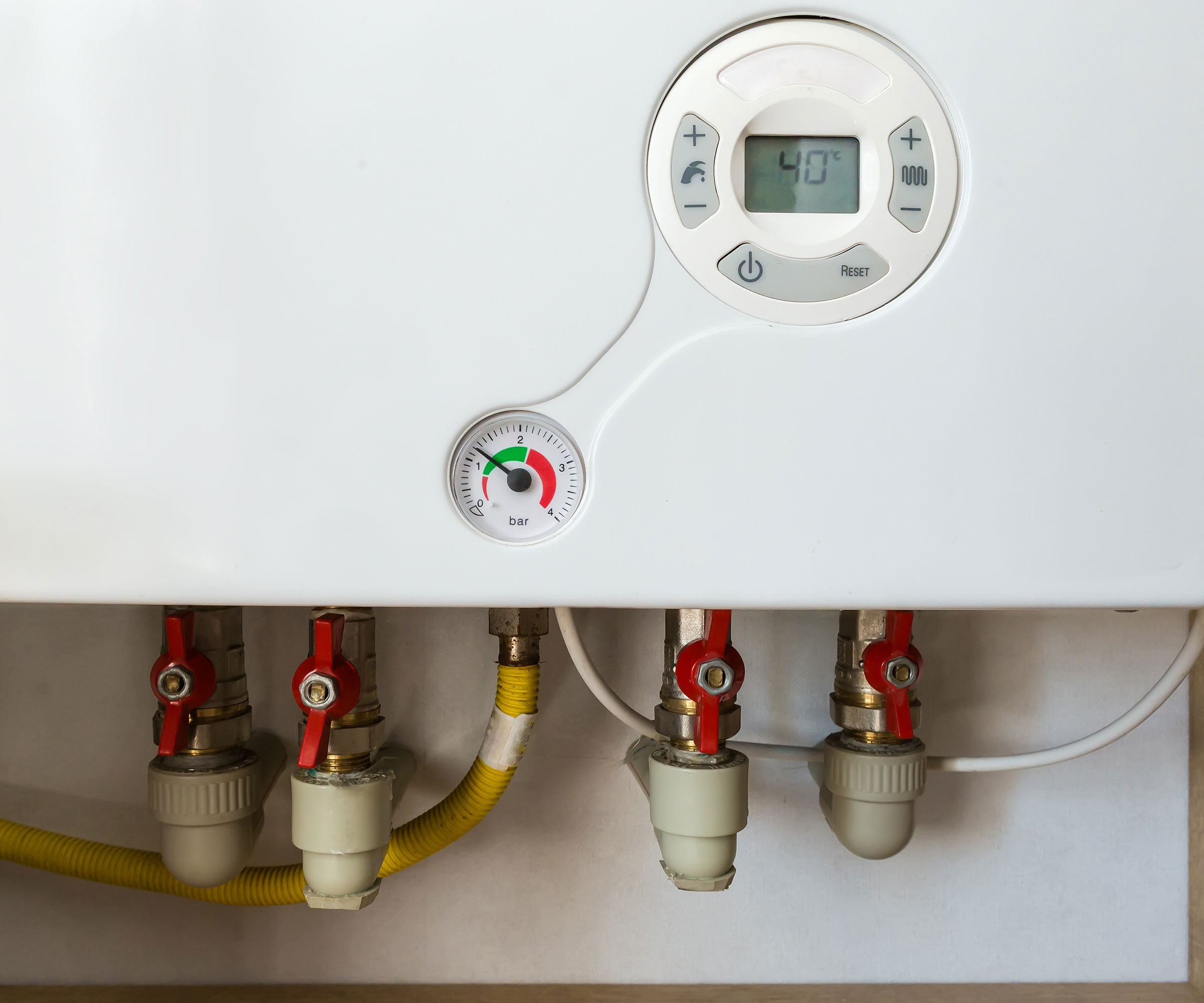 close up picture of a gas boiler showing pressure gauge