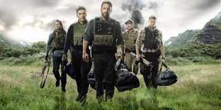 Triple Frontier the team walks through the jungle armed and with bags full of money