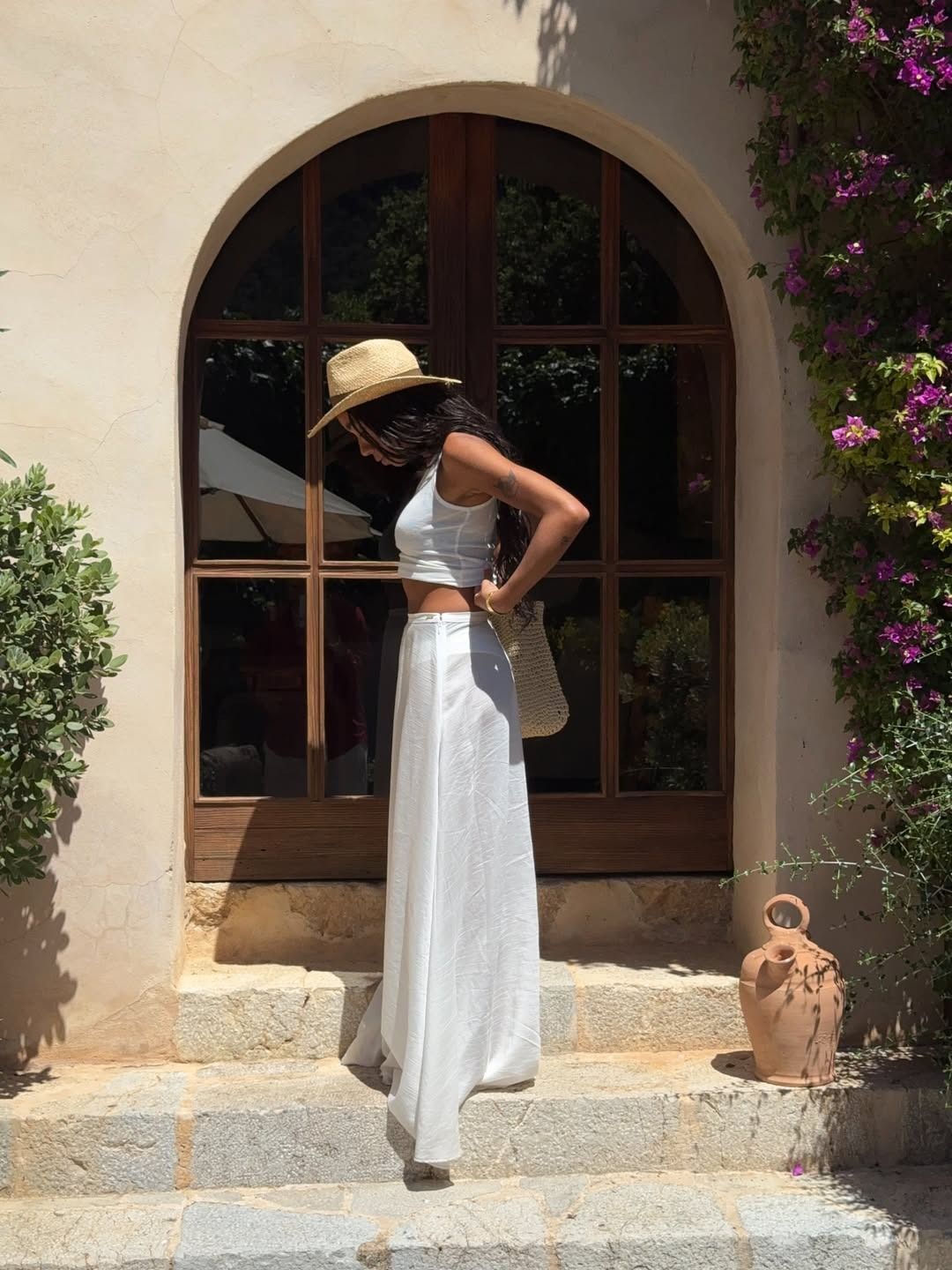 Influencer wearing a long full white maxi skirt