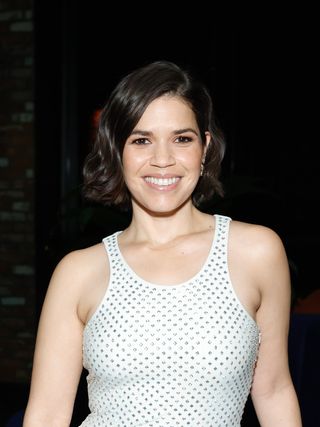 America Ferrera with her short hair slightly wavy.