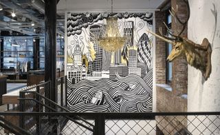 A metropolis themed mural by British artist Stanley Donwood in the store’s stairwell