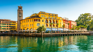 A view across colourful historic buildings in Riva Del Garda