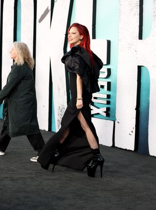 Lady Gaga attends the Los Angeles Premiere of Warner Bros. Pictures "Joker: Folie a Deux" at TCL Chinese Theatre on September 30, 2024 in Hollywood, California wearing a cape black dress