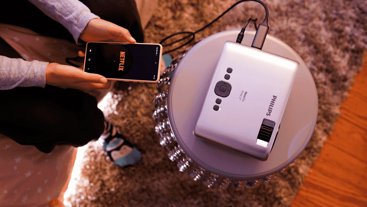 A top-down view of the Philips NeoPix projector on a small table