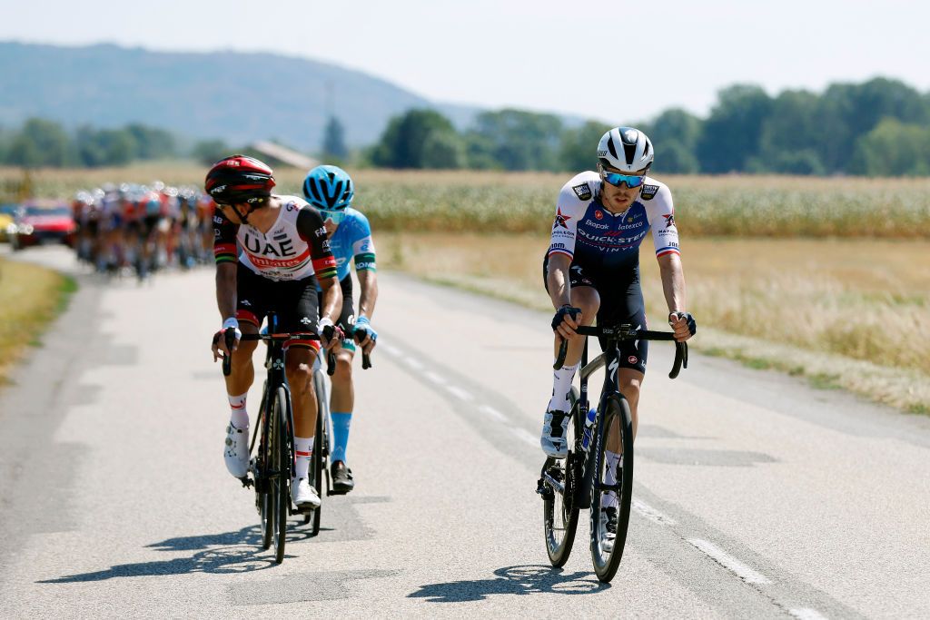 VALREVERMONT FRANCE AUGUST 09 Ryan Gibbons of South Africa and UAE Team Emirates and Rmi Cavagna of France and Team QuickStep Alpha Vinyl compete in the chase group during the 34th Tour de lAin 2022 Stage 1 a 152km stage from ChtillonSurChalaronne to ValRevermont TDA22 on August 09 2022 in ValRevermont France Photo by Bas CzerwinskiGetty Images
