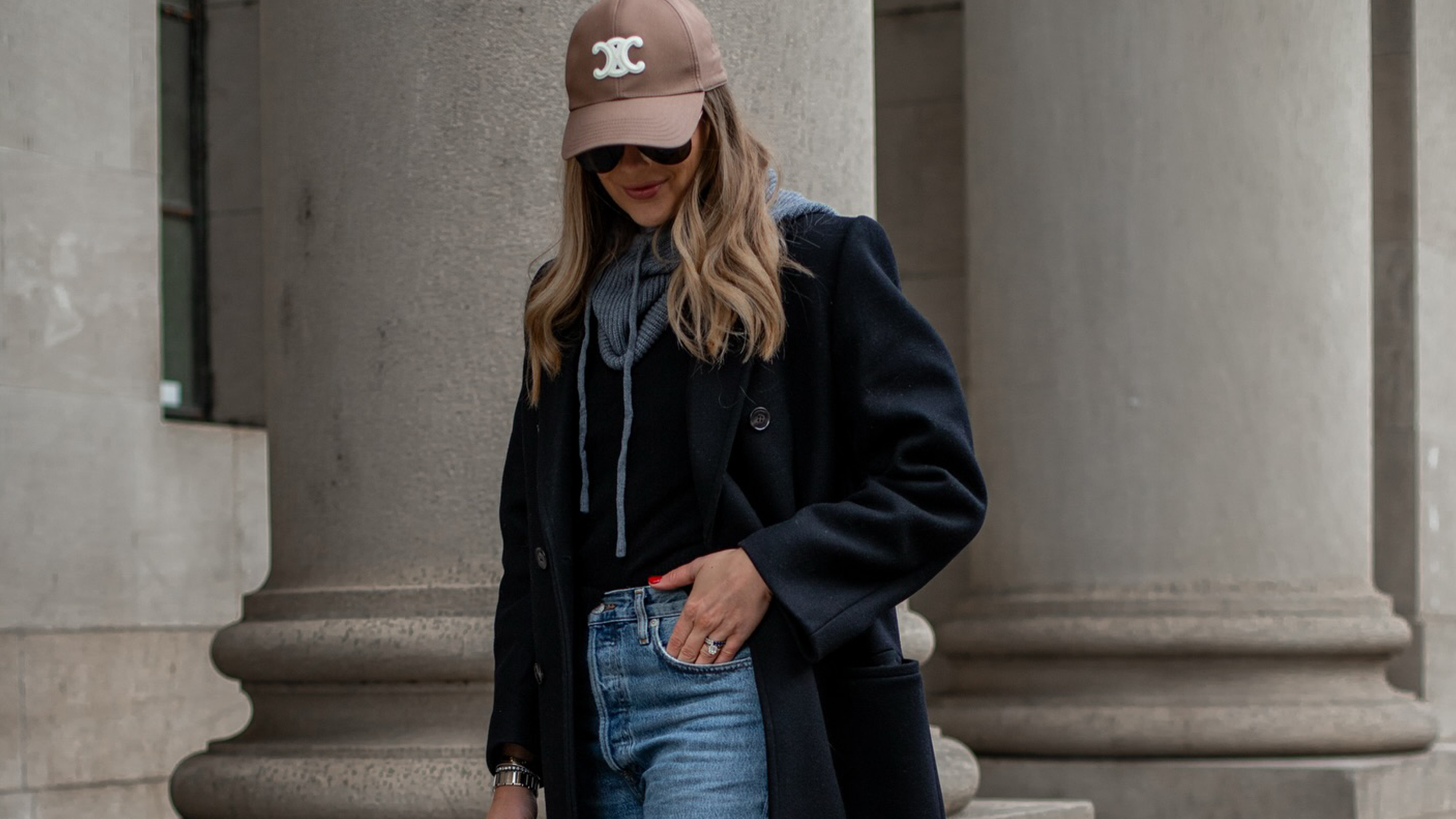 amy jackson wearing jeans and a baseball cap