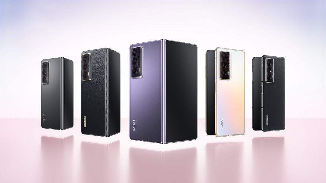 The Honor Magic V2 shown in colors such as Silk Purple, Gold, and black.