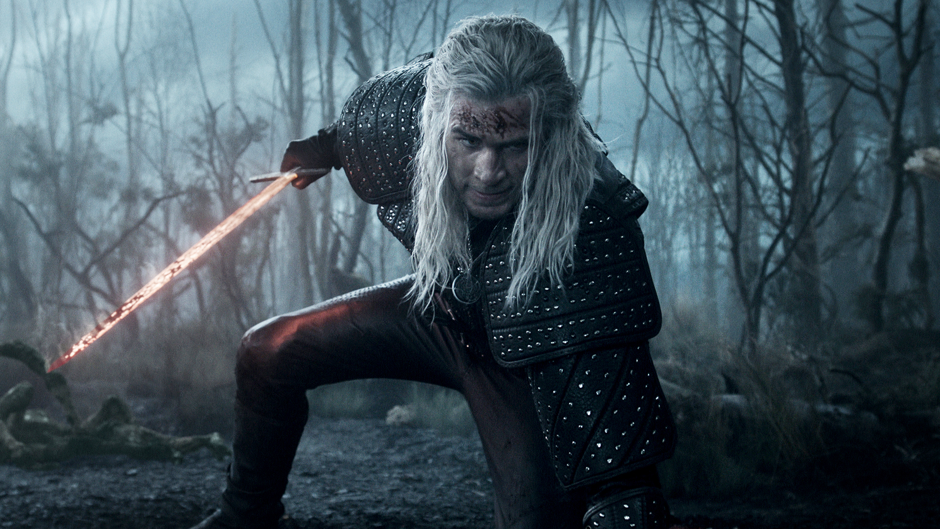 Geralt holding his glowing sword and posing in The Witcher season 4