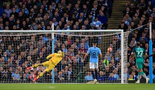 Ederson dives to his left but cannot deny Son Spurs' second to make it 3-1 on aggregate