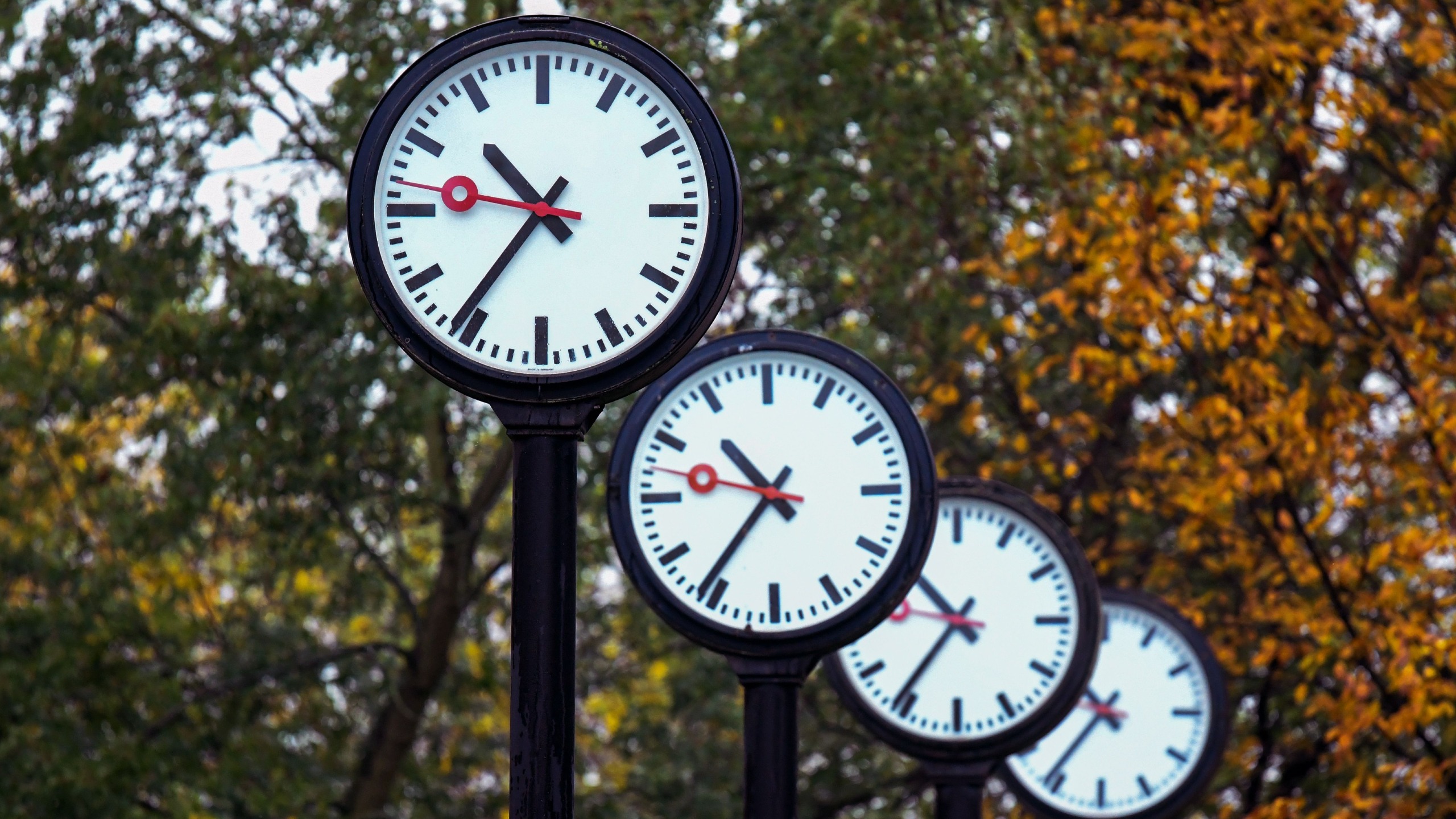A row of clocks in Germany in autumn, just before daylight saving time 2026