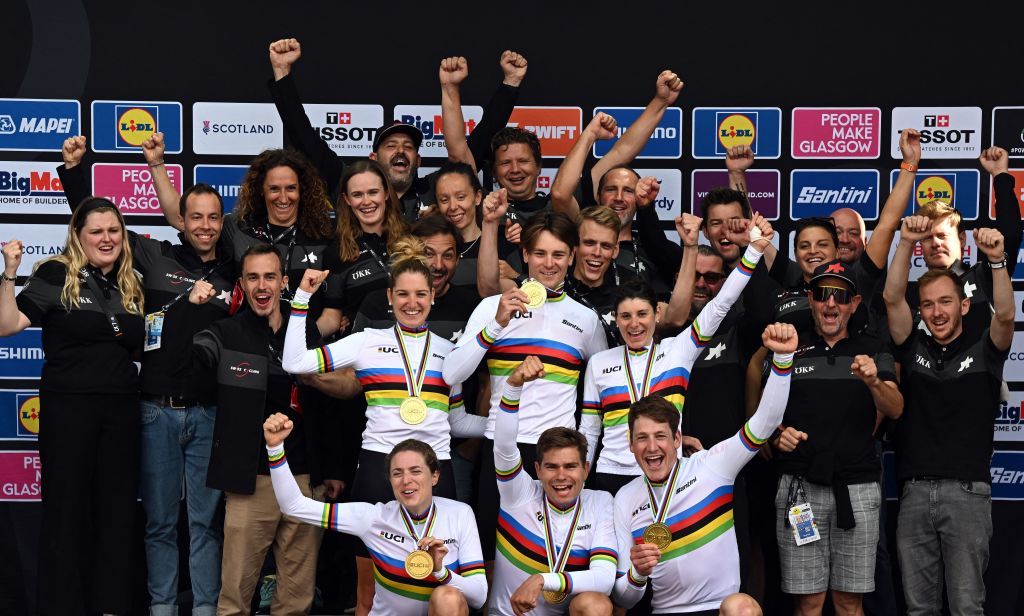 Riders from Switzerland celebrate with their gold medals and cow mascots after the Team Time Trial Mixed Relay road race during the UCI Cycling World Championships in Glasgow Scotland on August 8 2023 France won silver and Germany bronze Photo by Oli SCARFF AFP Photo by OLI SCARFFAFP via Getty Images