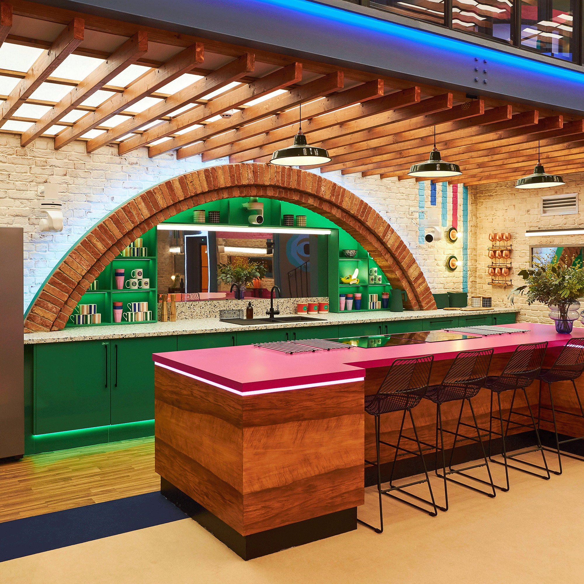 Big Brother house kitchen with red brick arch
