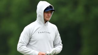 Golfer wearing a hoodie