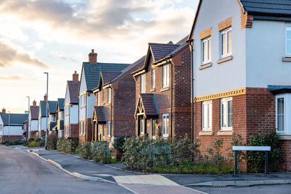 Houses in England with typical red bricks at sunset 