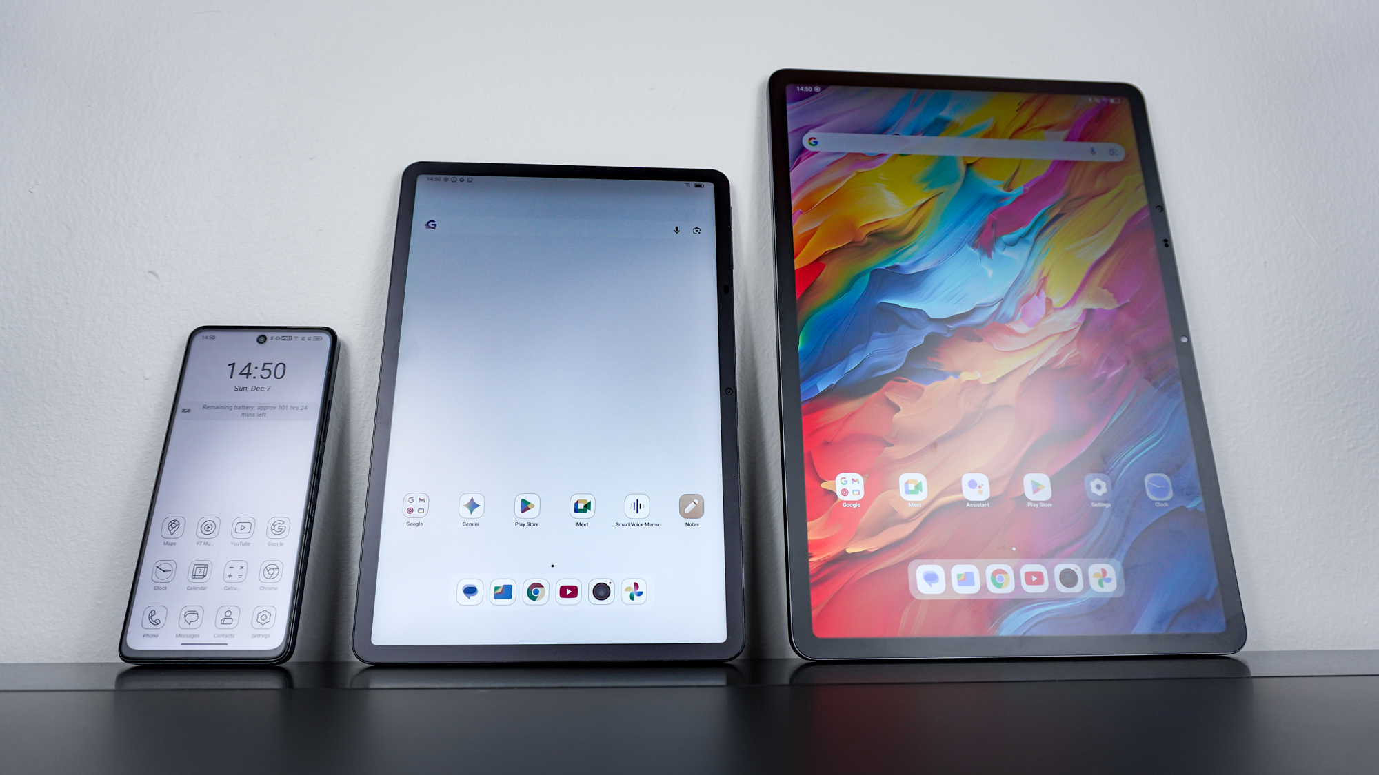 The TCL NXTPAPER 50 XE, the TCL NXTPAPER 11 Plus and the TCL NXTPAPER 14 side by side on a desk with each device showing a different display mode of TCL's NXTPAPER tech
