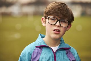 Oliver Savell as Young Alan Carr in Changing Ends