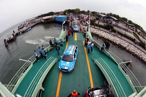 Team cars board the boat to Venice's Lido ahead of Giro d'Italia stage one.