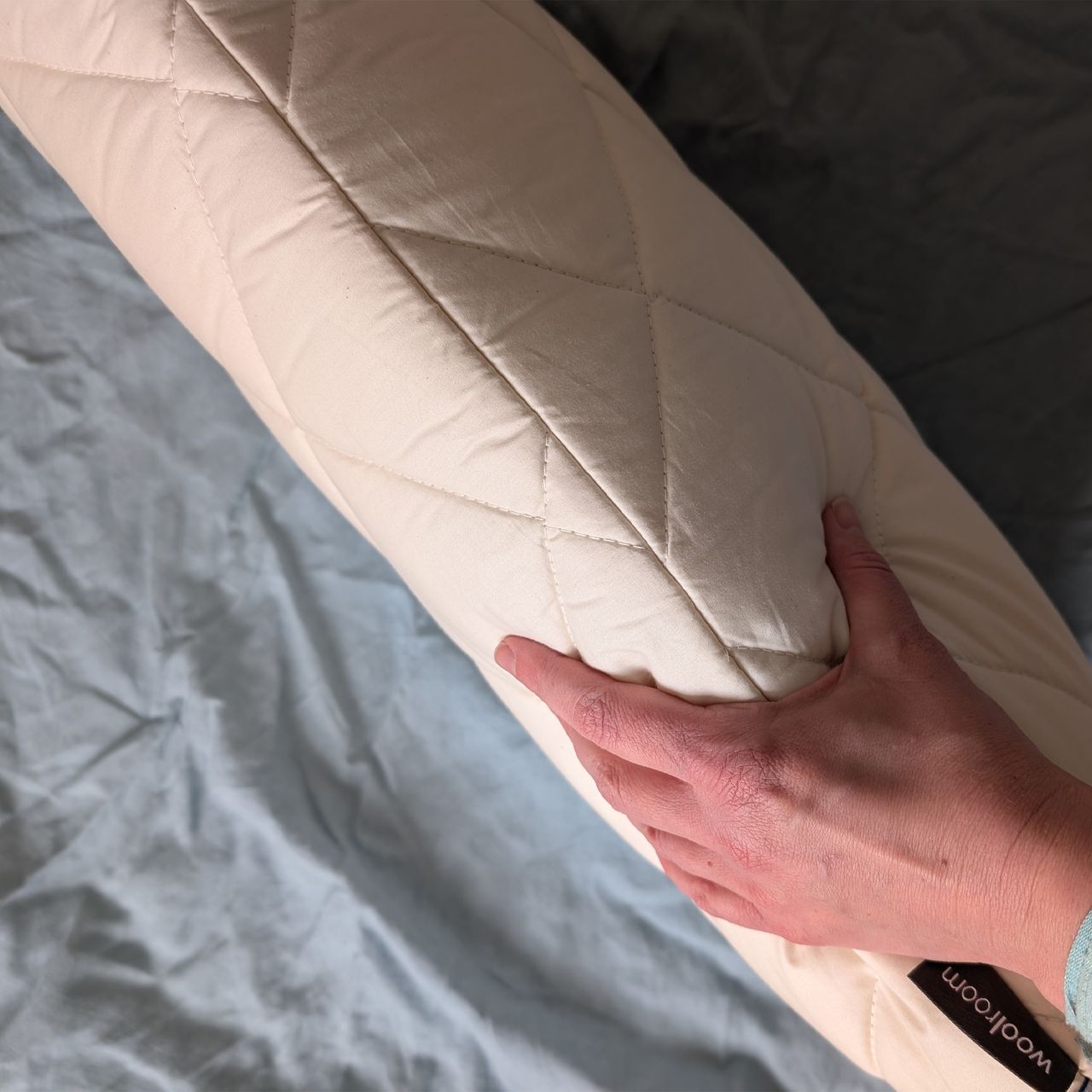The Woolroom Natural Latex Washable Wool Pillow being tested