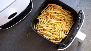 Chips cooking in an air fryer to support what you need to know before buying an air fryer