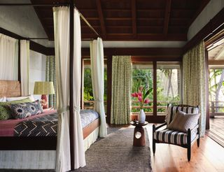 tropical looking bedroom design with natural materials and plants