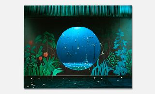 An aqua blue piece of art work with an earth-like feature and plants surrounding it.