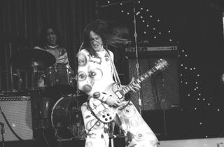 Todd Rundgren, wielding the legendary “The Fool” SG onstage