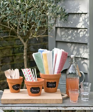 pool party ideas terracotta pots with straws and cutlery