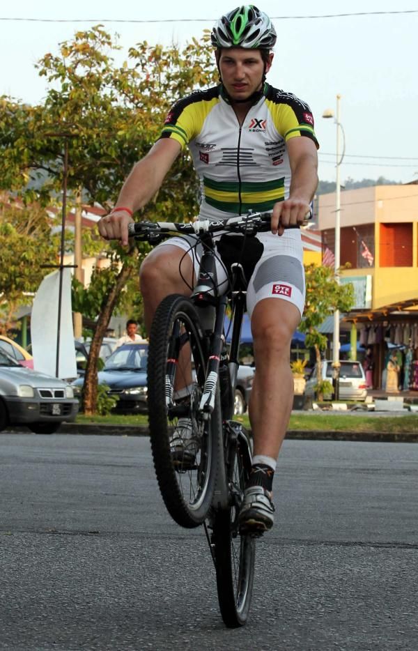 Paul van der Ploeg does a wheelie during training today