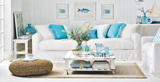 White living room with white sofa and blue accessories for nautical touch