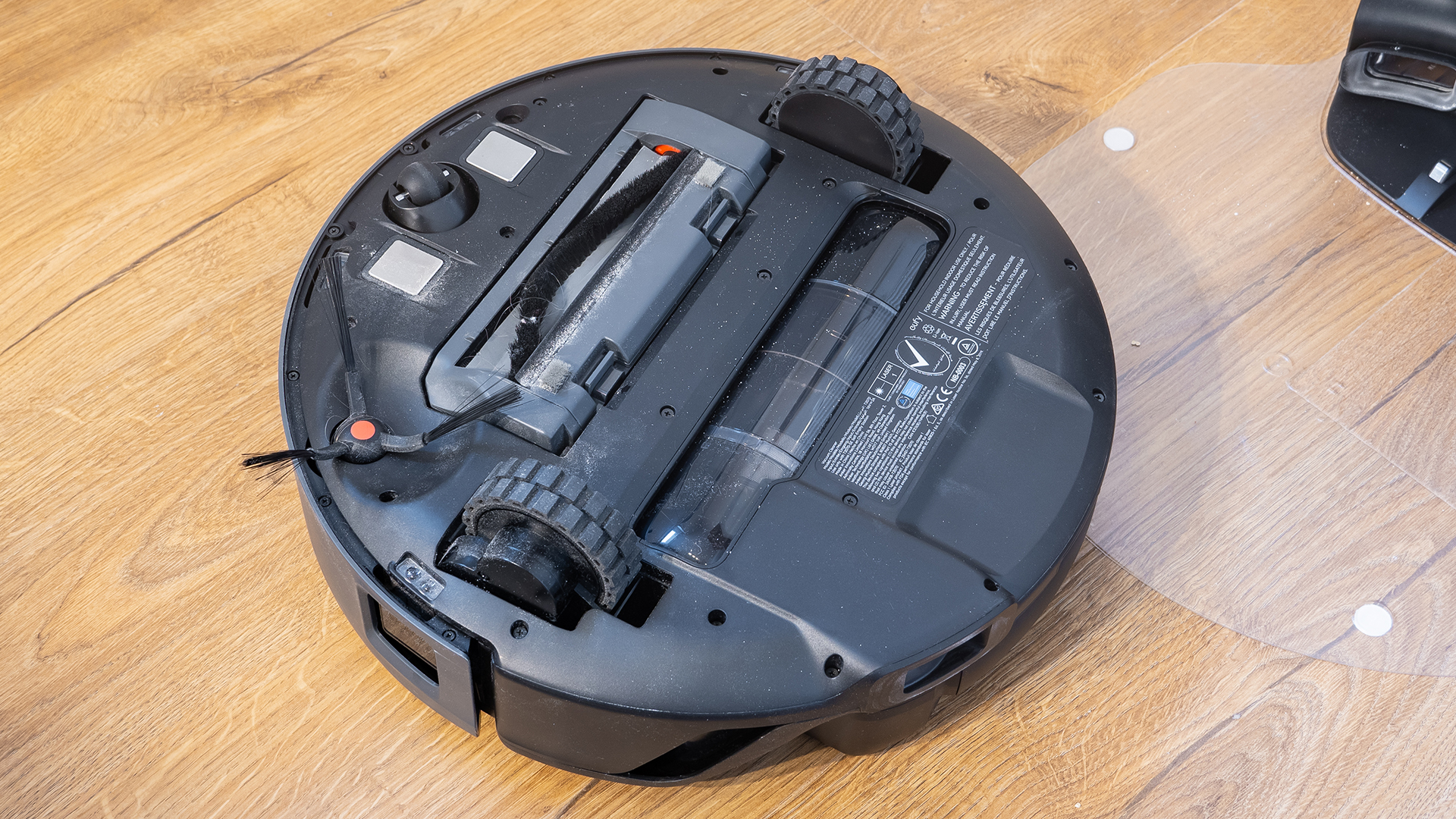 Eufy E20 robot vacuum, flipped over to show underside