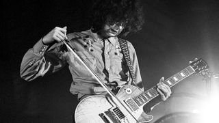 Jimmy Page of Led Zeppelin plays a Gibson Les Paul Standard guitar with a violin bow while performing on stage at Oude Rai on 27th May 1972 in Amsterdam, Netherlands